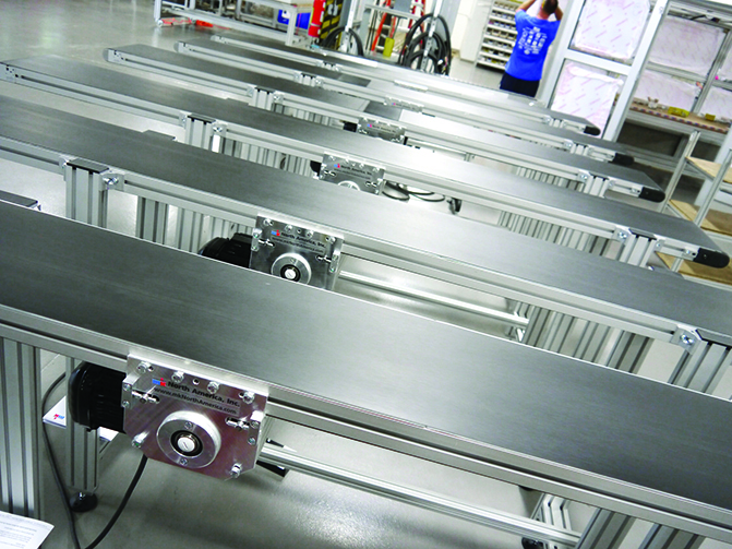 mk North America offers more than 20 different conveying systems for long life and reliable operation, including these flat belt conveyors.