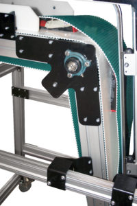 Belt-over-belt conveyors are designed such that product is held in place between two flexible belts that move together at the same speed.